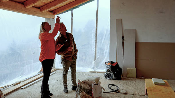 istock Mature couple inside new home construction 2244359467