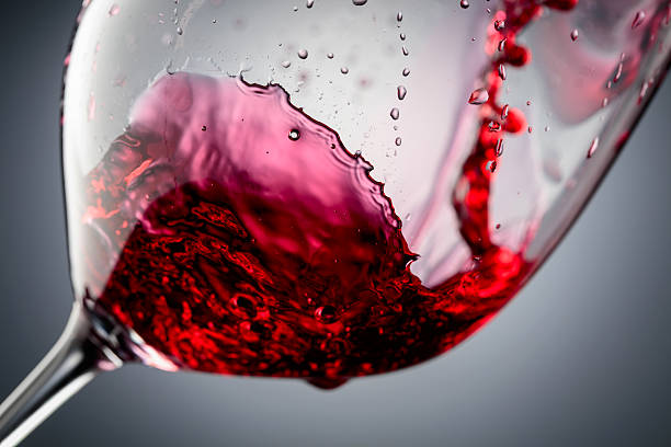 istock Red wine is poured into a glass. 2244360890
