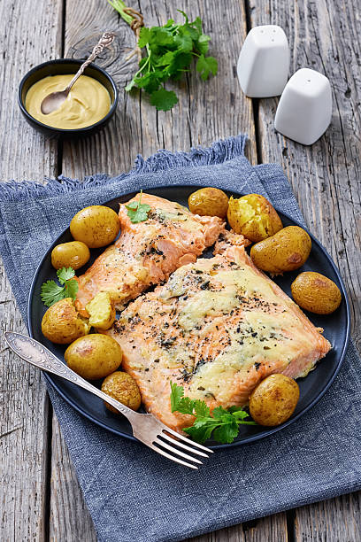 Salmon fillet with cheese, spices, baby potatoes