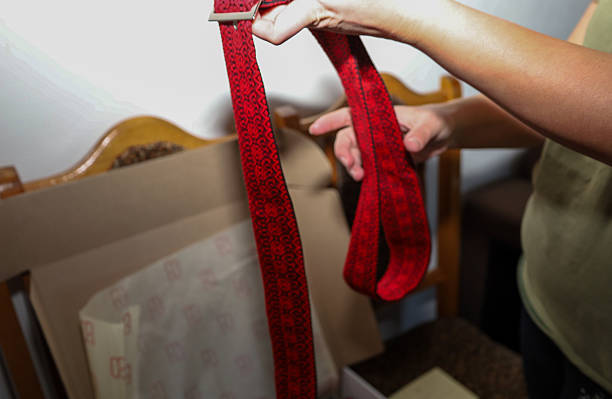 Using webbing sling to hook-up on the heavy metal pipe, prepare for lifting it up. Industrial operation and lifting equipment object photo. Selective focus at the sling sling part.
