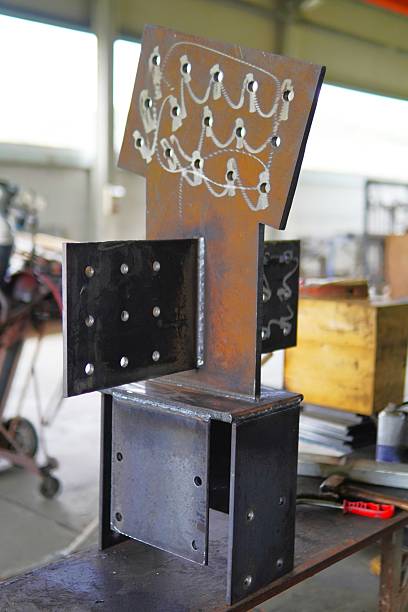 istock Steel structures, metalwork, and welding. Large steel components in an industrial workshop. Structural steel with welded joints and bolt holes. 2244361754