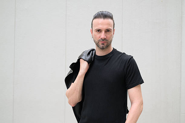 istock Portrait of handsome Italian man with beard against plain background 2244362931