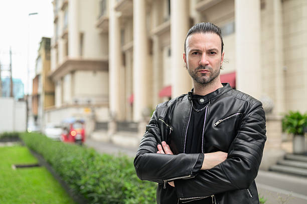 Confident bearded man wearing black leather jacket