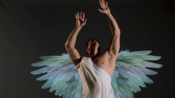 istock Renaissance-style warrior angel concept: powerful male figure in classical white robe. 2244367486