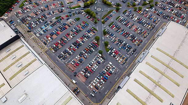 Aerial view of parked cars at parking lot, urban life concept.