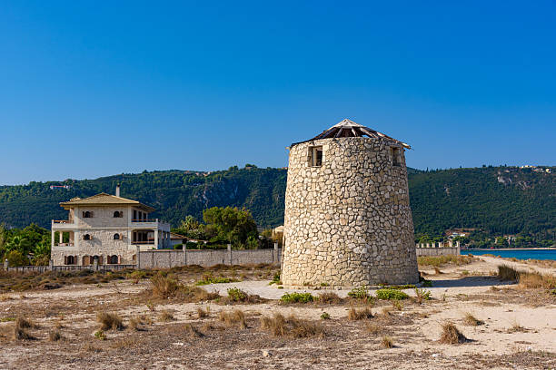 Old windmill at Agios Ioannis beach, Lefkada, Greece. Ruin of an old windmill.