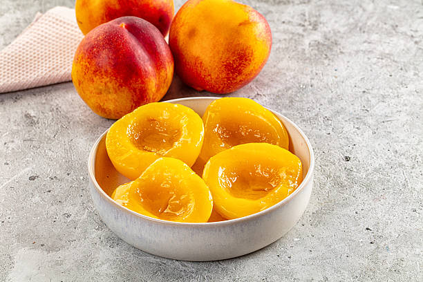 istock Sweet juicy canned peaches dessert 2244385491