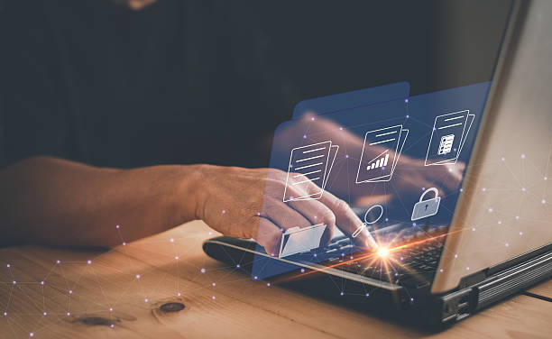 istock Document Management System (DMS) for paperless office concept, Businessman work on laptop computer with folder and documents icons on virtual screen, Software for manage and protect files and data. 2244385948