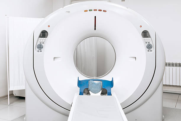istock Modern CT scanner positioned in a well-lit medical room 2244386676