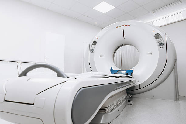 istock Modern CT scanner positioned in a well-lit medical room 2244386677