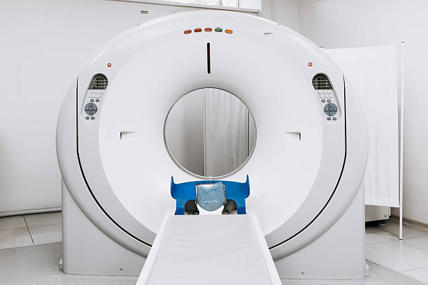 istock Modern CT scanner positioned in a well-lit medical room 2244386678