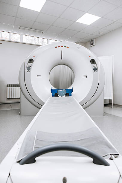 istock Modern CT scanner positioned in a well-lit medical room 2244386691