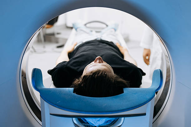 istock Individual receiving CT scan in clinical environment 2244386763