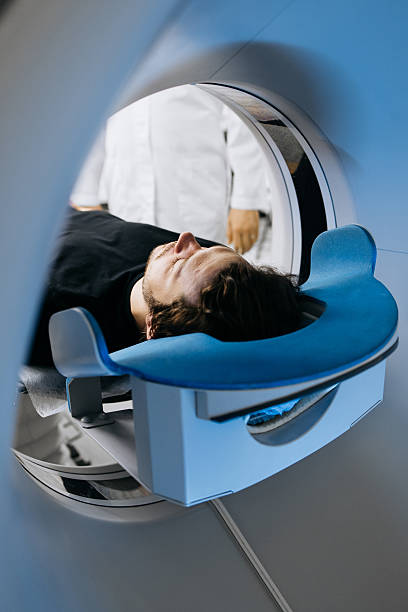 istock Individual receiving CT scan in clinical environment 2244386765