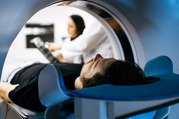 istock Individual positioned for CT scan in a contemporary medical setting 2244386770