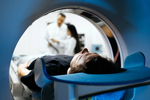 istock Individual positioned for CT scan in a contemporary medical setting 2244386784
