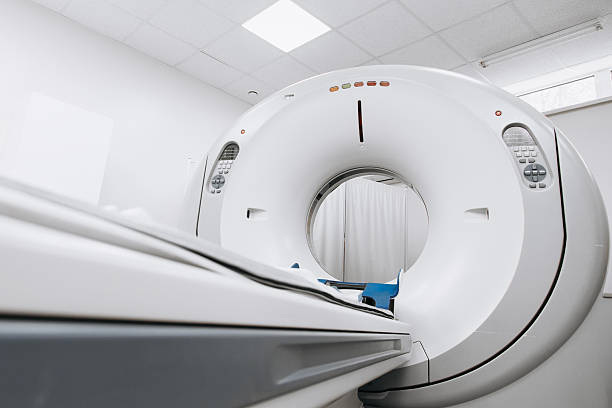 istock Modern CT scanner positioned in a well-lit medical room 2244386787