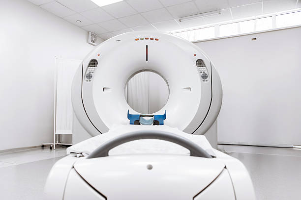 istock Modern CT scanner positioned in a well-lit medical room 2244386793