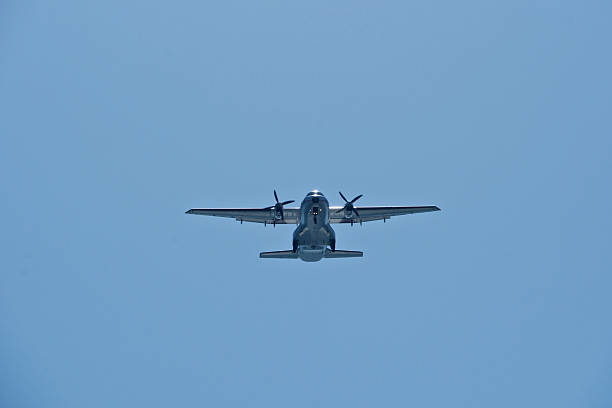 istock Two-engine airplane in the blue sky. Turboprop transport aircraft 2244386973