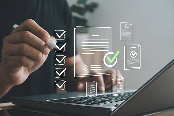 istock Businessman using a laptop and digital pen to complete online documents and checklist approval. Concept of task management, digital workflow, productivity and document verification in modern business. 2244388110