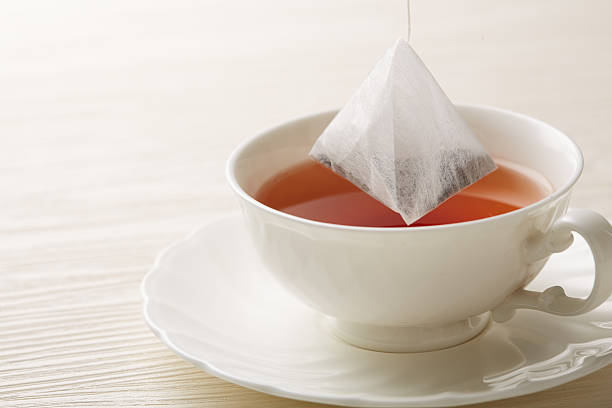 istock Image of warm tea on white background 2244390888