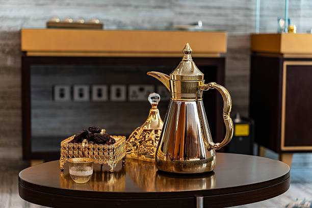 istock golden coffeepot, coffee mug and dates. Drinking coffee in Arabic style. Coffee house 2244392253