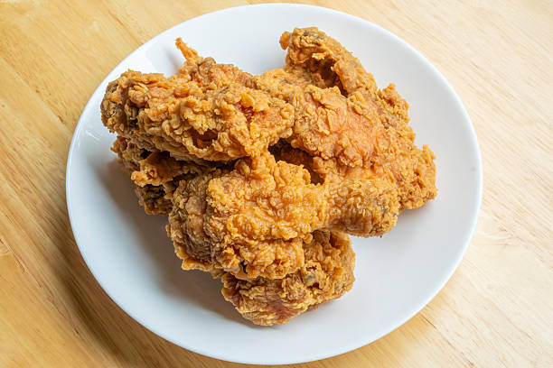 istock Crispy fried chicken in white plate on wood table 2244392508