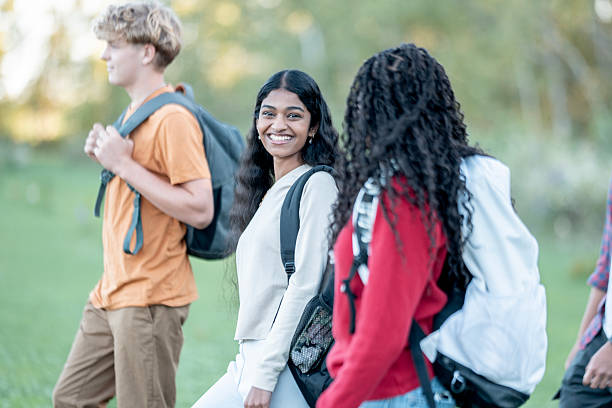istock Diverse Group Of Students Walking Outdoors With Backpacks, Smiling And Socializing On Campus 2244392848