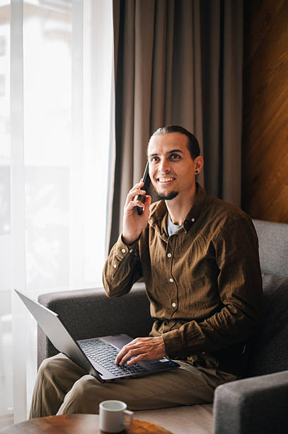 istock Young man in a comfort room working on his laptop. 2244392997
