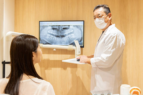 istock A dentist explaining the dental condition and treatment options to a patient 2244394006