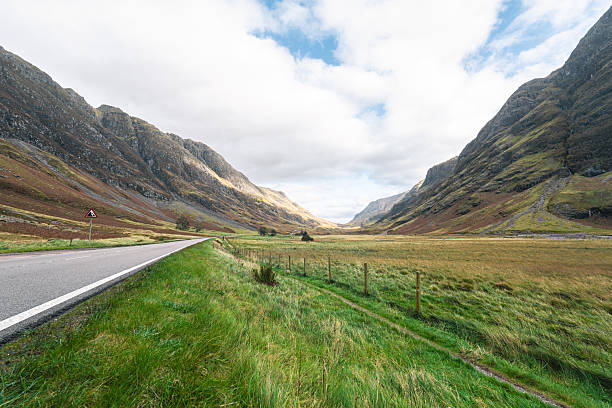 Scenic road traveling through the dramatic glencoe valley landscape