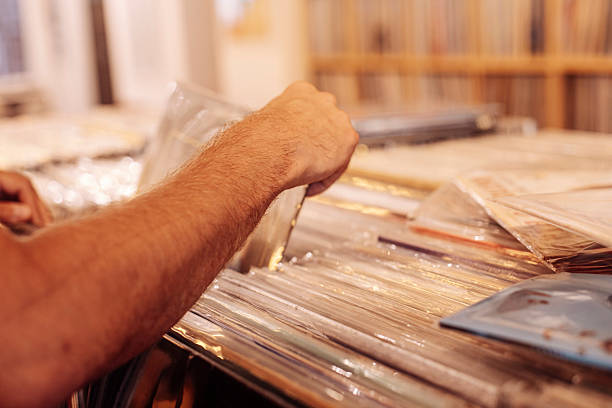 istock Man Browsing Vinyl Records in a Music Store 2244395315