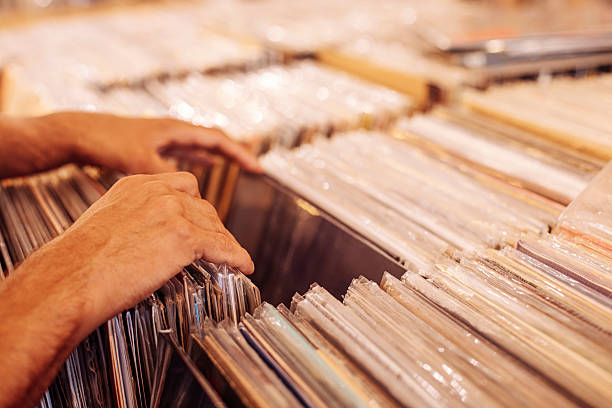 istock Man Browsing Vinyl Records in a Music Store 2244395317