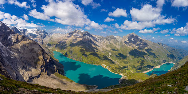 istock High resolution widescreen panorama of mountain landscape 2244395641