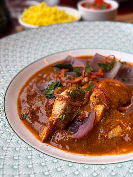 istock Image  of authentic west Indian malvani chicken curry with pilau saffron rice / traditional Indian restaurant cuisine 2244395796