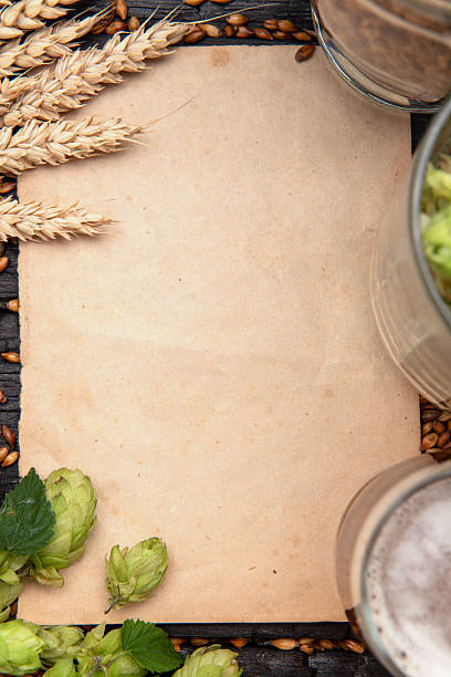 istock Blank paper sheet with hops and barley for recipe or beer menu 2244396055