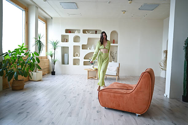 istock Woman posing in modern studio with plants 2244398558