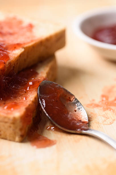 istock Strawberry jam for a classic breakfast on wooden background 2244398761