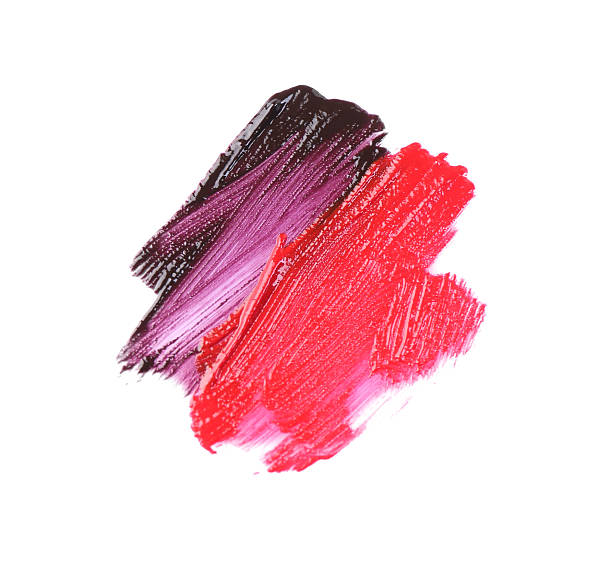 istock Strokes of different lip glosses isolated on white, top view 2244398980