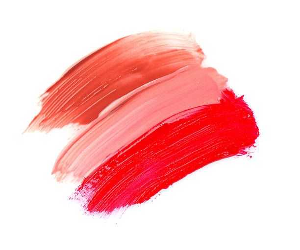istock Strokes of different lip glosses isolated on white, top view 2244399003