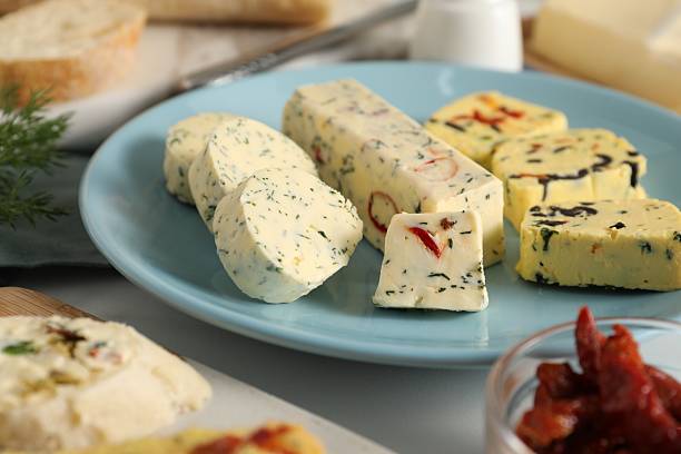 istock Different types of tasty butter on white table, closeup 2244399644