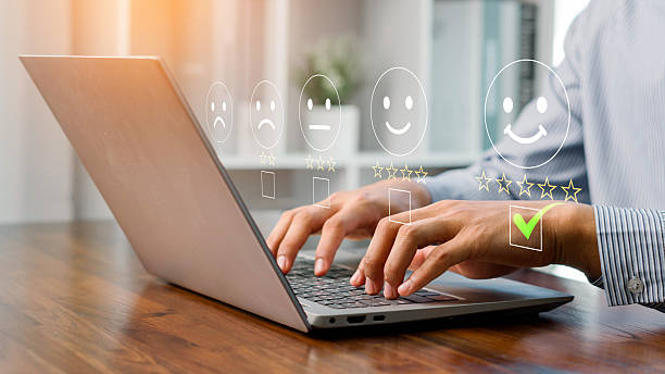 istock A person using a laptop to rate customer satisfaction with five-star feedback, showing online service quality, user experience, digital communication, and business review for marketing and improvement. 2244406038