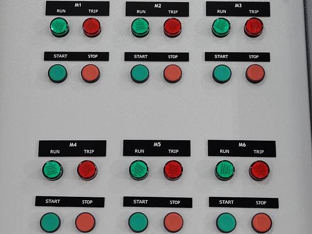 istock Automation technology, grid of labeled push buttons on an electrical switchboard. 2244407445