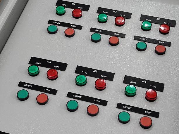 istock Automation technology, grid of labeled push buttons on an electrical switchboard. 2244407446