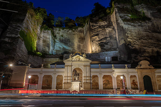 View of an historic monument below a hill in the old town area at night on September 04, 2022 in Sazlburg, Austria