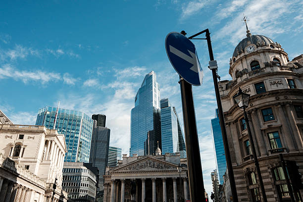 istock Royal exchange building and modern london skyscrapers under blue sky 2244412376