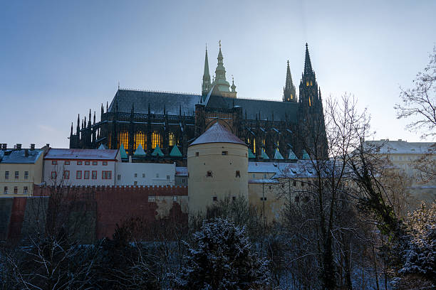 This is a winter snowy view of Prague Castle, a UNESCO World Heritage Site and popular travel destination on December 13, 2022 in Prague, Czech Republic