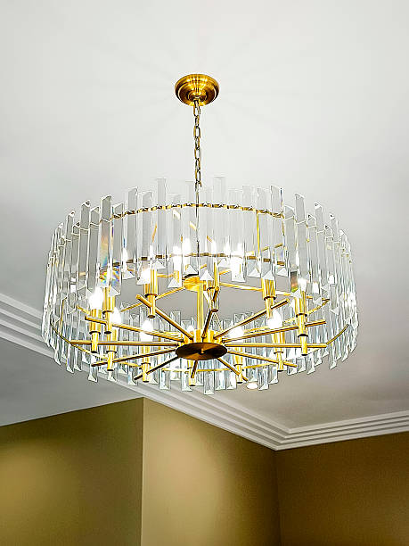 istock A beautiful classic crystal chandelier hangs from the ceiling. Vertical photo. 2244416763