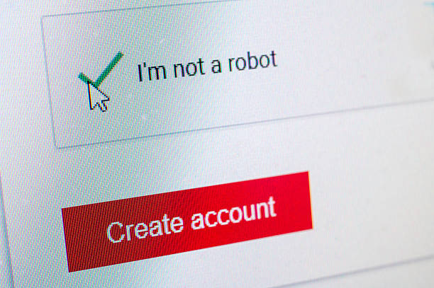 istock Not a Robot Captcha and Create Account Screen With Green Check Mark On Red Button 2244418082