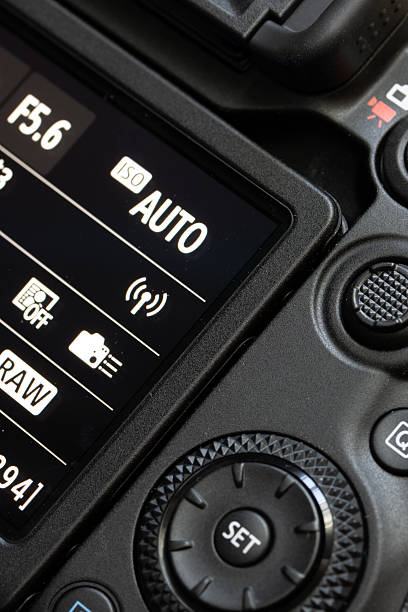 The back of digital camera with control buttons and display, close up.